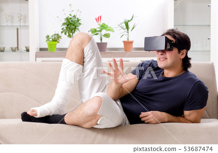 Leg injured young man suffering at home  53687474