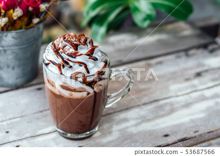 Hot chocolate cocoa in glass mug with whipped 53687566