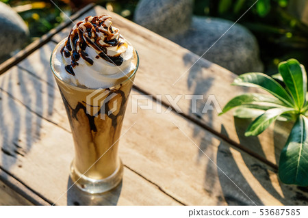 Coffee frappe with whipped cream on old wooden 53687585