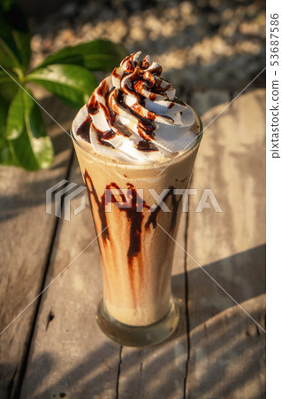 Coffee frappe with whipped cream on old wooden 53687586