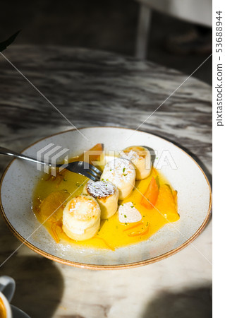 Cottage cheese pancakes with orange jam 53688944