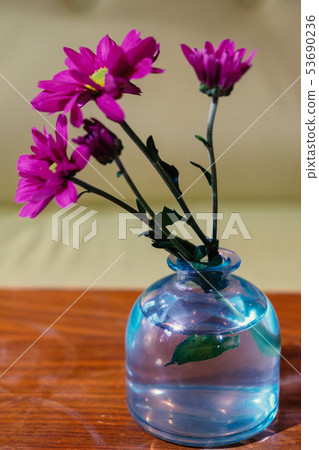 Flowers in botle of blue color 53690236