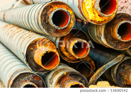Bunch of old rusty pipes with footprint of welding Bunch of old rusty pipes with footprint of welding 53690542