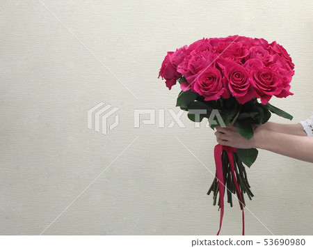 Bouquet of red roses in women hands. 53690980