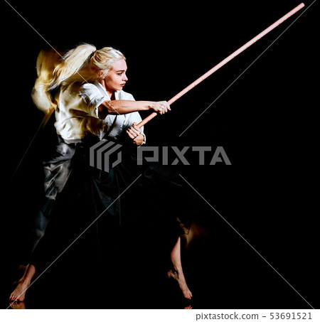 Bo-Jutsu budoka woman isolated black background Bo-Jutsu budoka woman isolated black background 53691521