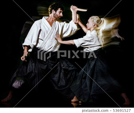 Aikido budokas man and woman isolated black background 53691527