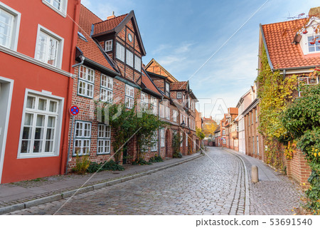Street with Medieval old brick buildings. 53691540
