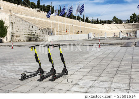 few electric scooters parked 53691614
