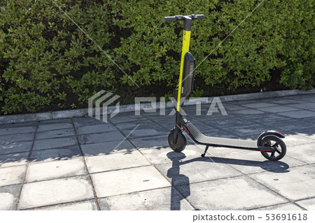one electric scooter parked 53691618