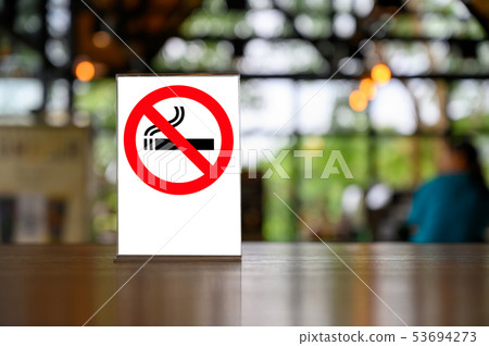no smoking sign with shopping place background on no smoking sign with shopping place background on 53694273