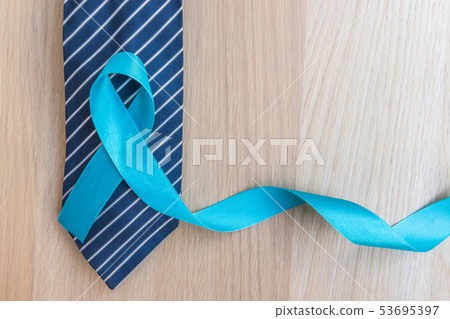 Blue ribbon symbolic of men health in November Blue ribbon symbolic of men health in November 53695397