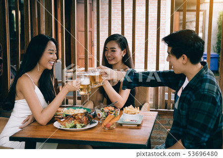 Group of asian people cheering beer at restaurant 53696480
