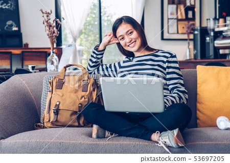 Asian teenager girl using laptop computer and Asian teenager girl using laptop computer and 53697205