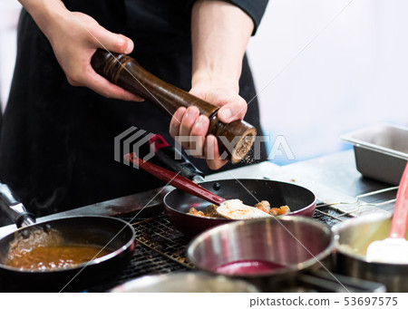 Chef cooking food in the kitchen, Chef preparing 53697575