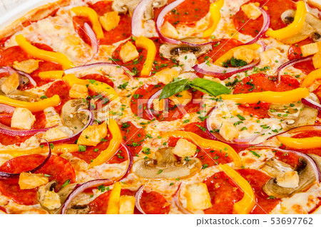 Pizza with salami and mushrooms 53697762