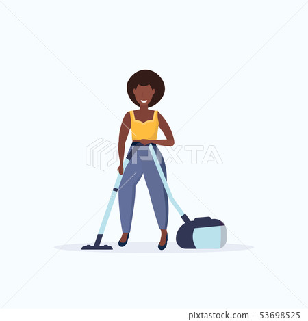 woman using vacuum cleaner african american housewife cleaning service housework floor care concept 53698525