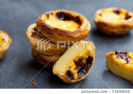 Egg tart, traditional Portuguese dessert, pastel de nata. Slate background. Close up. 53698688