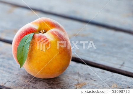 Fresh peaches on grey wooden background. Close up. Copy space. 53698753