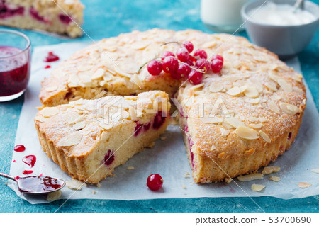Almond and berry cake, Bakewell tart. Traditional British pastry. Blue background. 53700690