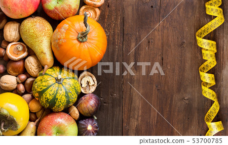 Autumn border on a wooden table 53700785