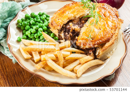 Homemade beef stew pie with french fries Homemade beef stew pie with french fries 53701144