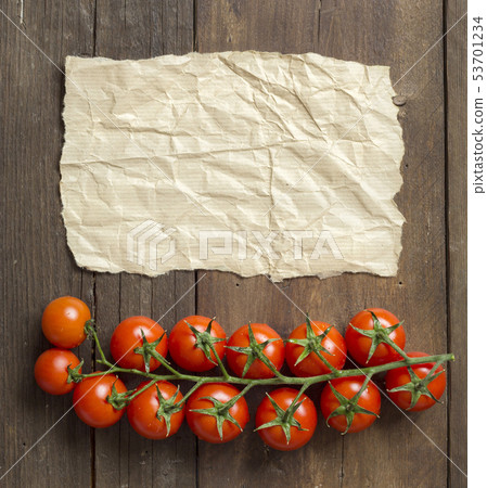 Cherry tomatoes and craft paper 53701234