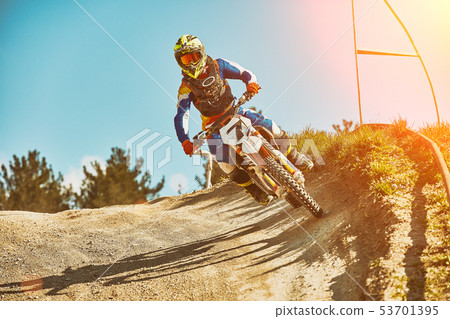 Extreme motorcycle race. Biker rides off-road on a motorcycle for extreme racing. Special processing 53701395