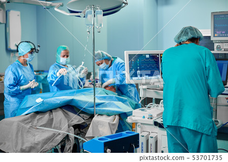 Electrocardiogram in hospital surgery operating emergency room showing patient heart rate with blur Electrocardiogram in hospital surgery operating emergency room showing patient heart rate with blur 53701735