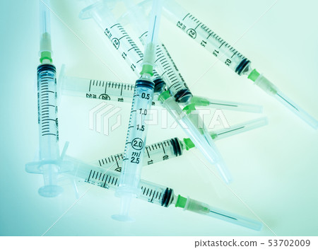 Syringes on blue background Syringes on blue background 53702009