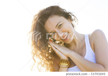 Young woman on the beach in summer Young woman on the beach in summer 53703845