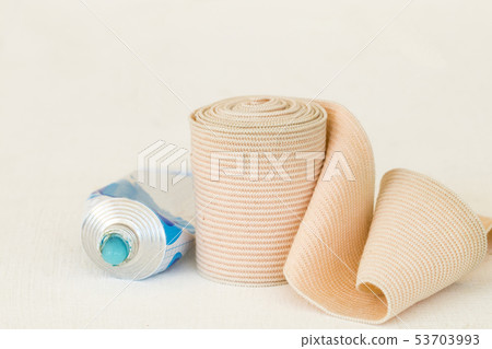 topical medication with roll bandage for first aid 53703993