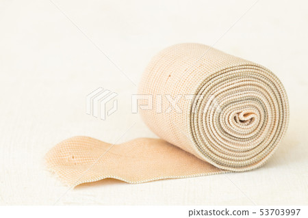 roll bandage for first aid accident  53703997