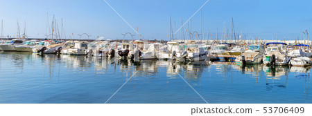Sailing, motor boats moored seawall. Blanes, Spain 53706409