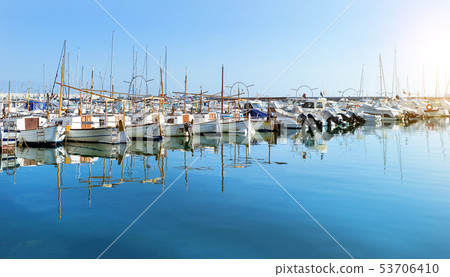 Sailing, motor boats moored seawall. Blanes, Spain 53706410
