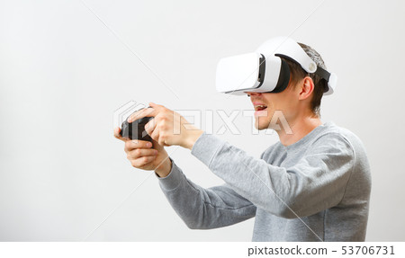 Man with virtual reality headset is playing game. Man with virtual reality headset is playing game. 53706731