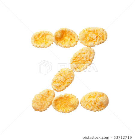 Yellow cornflakes letter Z isolated on white background. Alphabet cereal flakes Yellow cornflakes letter Z isolated on white background. Alphabet cereal flakes 53712719