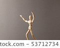 Man stretches his hand up on gray background. 53712734
