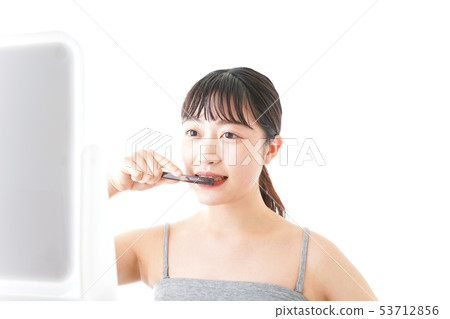 Young woman doing toothpaste Young woman doing toothpaste 53712856