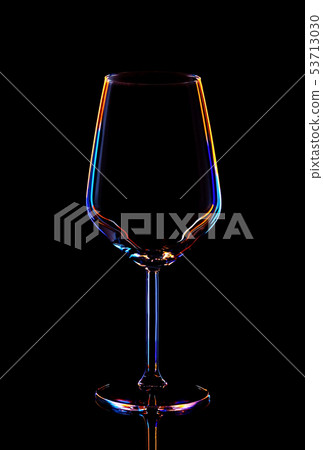 Glass for wine on a black background, multi-colored contours. Glass for wine on a black background, multi-colored contours. 53713030