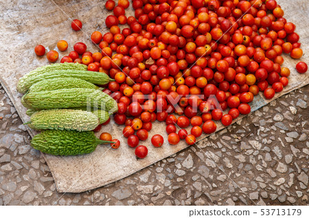 Fresh red tomatoes and Bitter gourd vegetables in 53713179