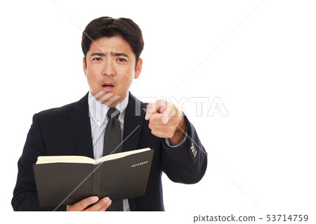 A businessman with an angry facial expression A businessman with an angry facial expression 53714759