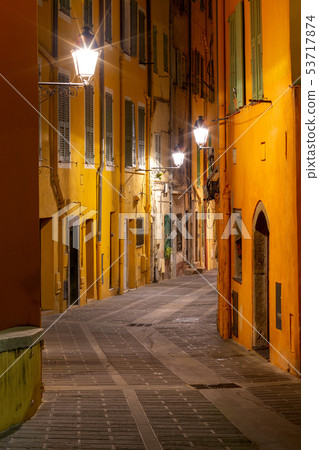 Menton. Old narrow street in the historic part of the city. Menton. Old narrow street in the historic part of the city. 53717874