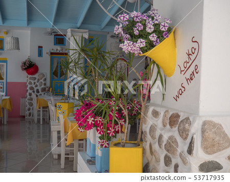 Traditional greek style flower decoration on the street 53717935