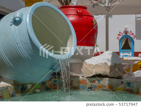 Traditional greek style flower decoration on the street 53717947