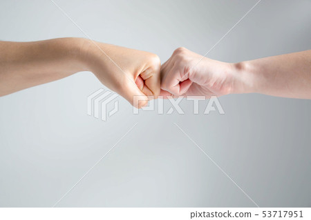 Hand symbol of two fists of friend crash together. 53717951