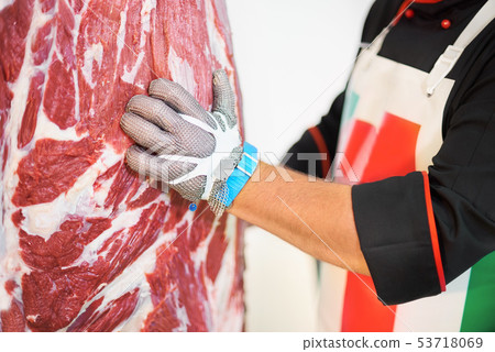 professional butcher in metal glove in factory professional butcher in metal glove in factory 53718069