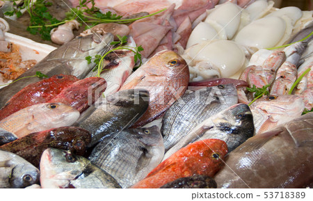Mixed fish for sale on a market Mixed fish for sale on a market 53718389