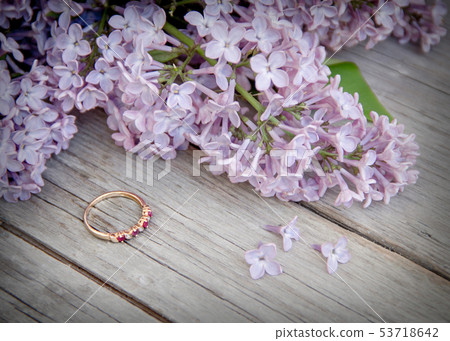 Ring and lilac on wood Ring and lilac on wood 53718642