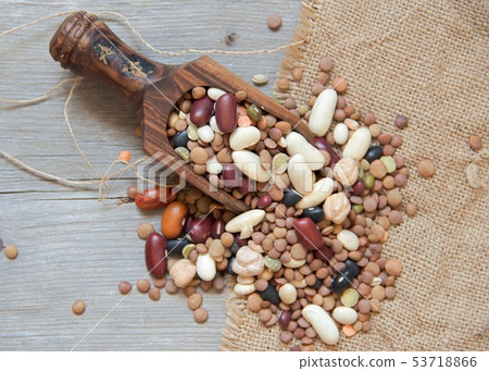 Legumes mix in the wood spoon 53718866