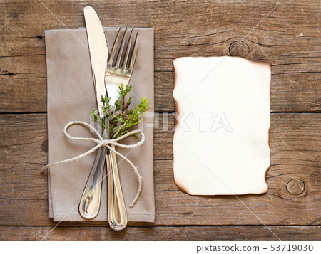 Rustic Table setting and old burned paper Rustic Table setting and old burned paper 53719030